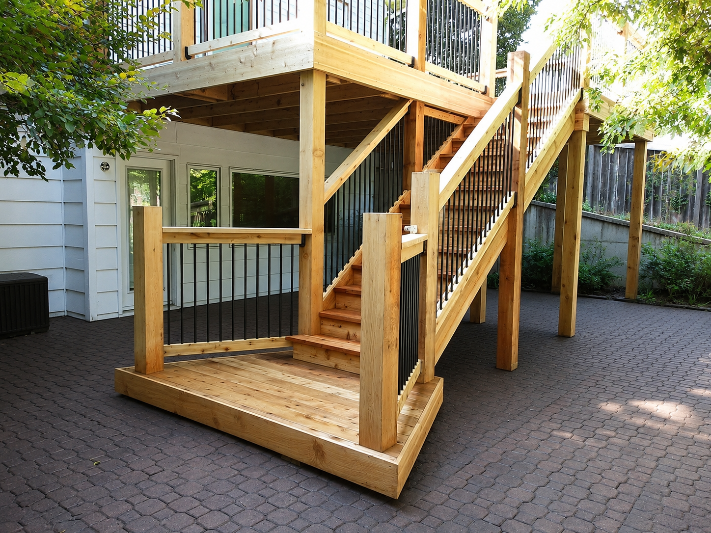 Custom staircase detail on a deck built by Jayhawk Construction